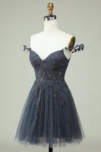 Robe de cocktail courte dos nu avec appliques