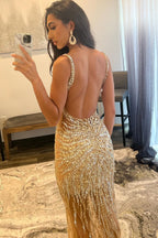 Robe de bal longue dos nu ornée de perles dorées