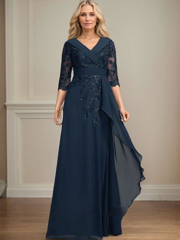 Vestido de novia de corte línea A, cuello en V, largo hasta el suelo, de encaje y gasa, con lentejuelas y volantes en cascada. 