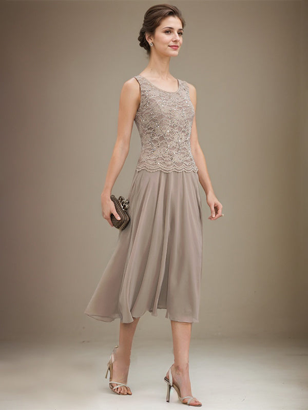 Vestido de novia de corte línea A, escote redondo, largo hasta la rodilla, de encaje y gasa con lentejuelas. 