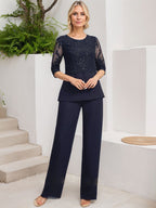 Vestido de novia de gasa con encaje y lentejuelas, estilo mono/traje pantalón, largo hasta el suelo, con escote redondo.