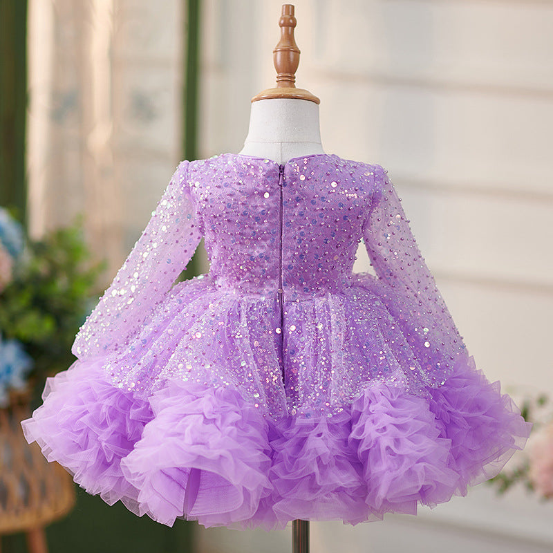 Vestido de bebé niña color lila con lentejuelas, mangas largas con volantes y lazo hasta la rodilla 