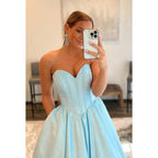 Vestido de fiesta largo de corte A con escote en forma de corazón, sin tirantes y brillante, con bolsillos