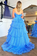 Charmante robe de bal longue bleue bustier trapèze à volants