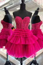 Robe de bal noire élégante à bustier cœur et corset, coupe trapèze, ornée de volants