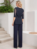Vestido de novia de gasa con encaje y lentejuelas, estilo mono/traje pantalón, largo hasta el suelo, con escote redondo.