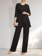 Vestido de novia de gasa con encaje y lentejuelas, estilo mono/traje pantalón, largo hasta el suelo, con escote redondo.