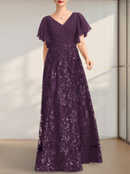 Vestido de novia de corte A, escote en V, largo hasta el suelo, de encaje, lentejuelas y gasa, con pliegues.