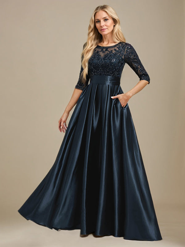 Robe de mariée longue en satin stretch dentelle et dentelle, coupe trapèze, décolleté illusion, ornée d'un nœud à sequins 