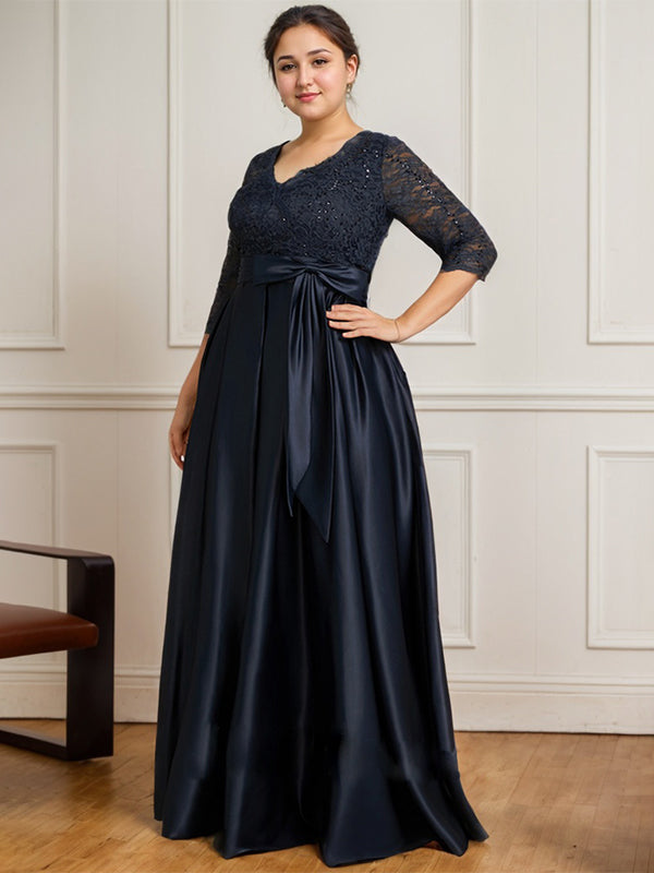 Vestido de novia de satén con encaje, corte en A, escote en V y largo hasta el suelo, con lazo de lentejuelas. 