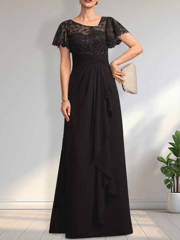Vestido de novia de corte asimétrico, ilusión, largo hasta el suelo, de encaje y gasa, con cascada de volantes y lentejuelas. 