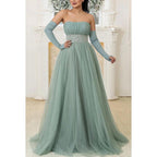 Robe de mariée longue trapèze en tulle froncé à paillettes et sans bretelles