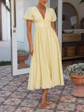 Robe longue oversize à manches bouffantes et col en V 