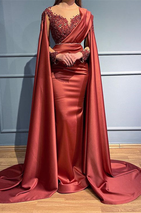 Vestido de fiesta de sirena con mangas largas, cuentas, apliques y volantes.