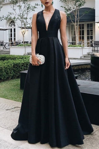 Vestido de fiesta negro de corte A, sin mangas, con escote en V y detalle de lazo.