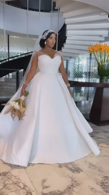 Vestidos de novia exquisitos de corte línea A, largos hasta el suelo, de manga larga, con encaje, escote en V y tul con pedrería.