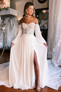 Robe de mariée trapèze bustier cœur manches longues fendue sur le devant avec dentelle
