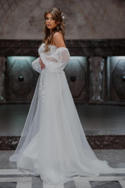 Vestidos de novia de corte sirena, sin tirantes, de tul y con encaje, de línea A y largo hasta el suelo.