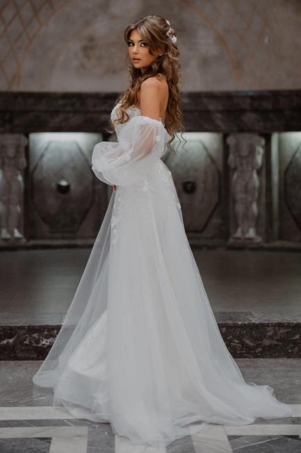 Vestidos de novia de corte sirena, sin tirantes, de tul y con encaje, de línea A y largo hasta el suelo.