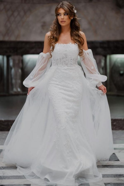 Vestidos de novia de corte sirena, sin tirantes, de tul y con encaje, de línea A y largo hasta el suelo.