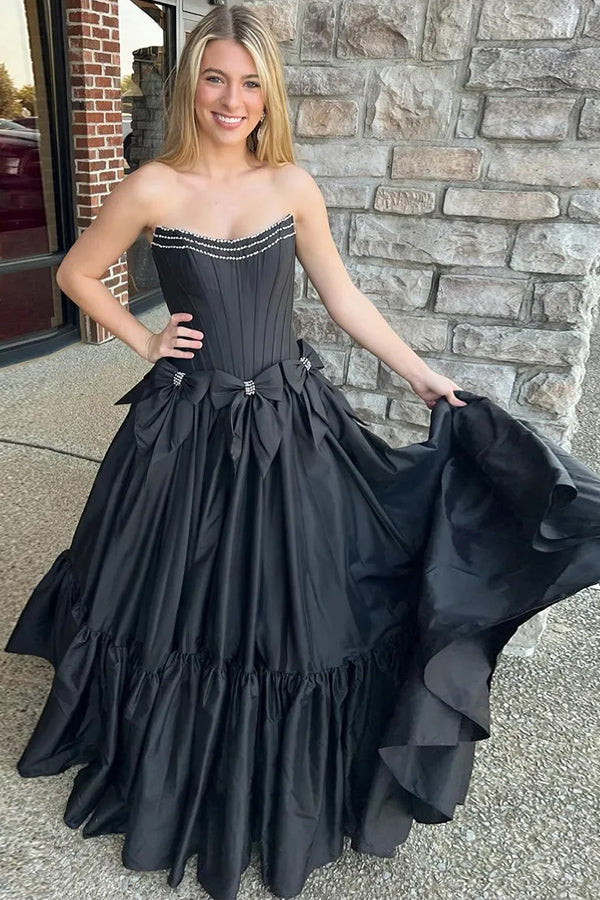 Vestido de fiesta negro de corte A, sin tirantes, con corsé y lazos, con cuentas.