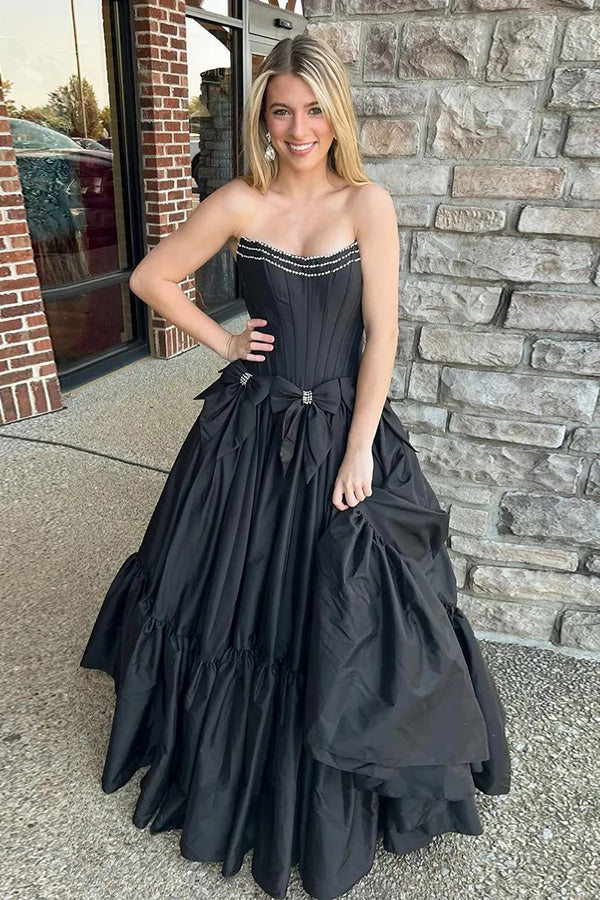Vestido de fiesta negro de corte A, sin tirantes, con corsé y lazos, con cuentas.