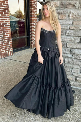 Vestido de fiesta negro de corte A, sin tirantes, con corsé y lazos, con cuentas.
