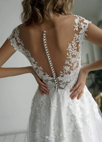 Vestido de novia corte A, elegante, con escote corazón, confeccionado en tela brillante y apliques WD570
