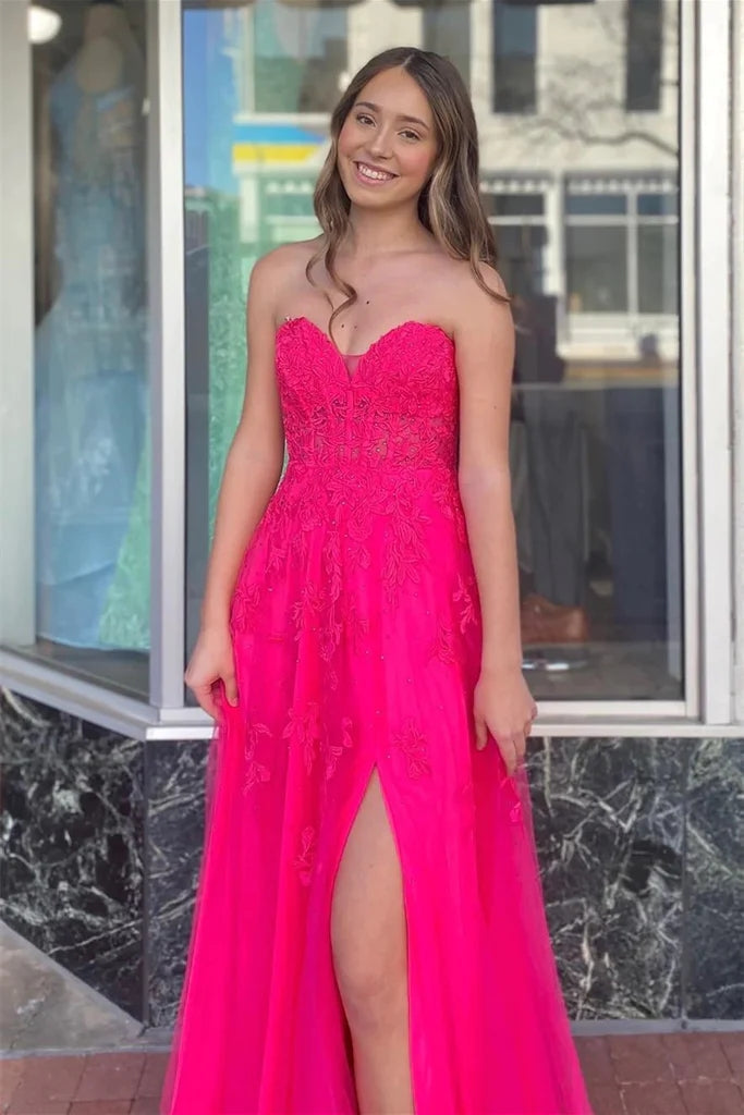 Vestido largo de fiesta corte A, rosa fucsia sin tirantes con apliques florales