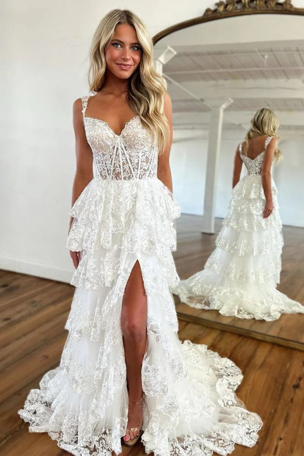 Vestido de noche de fiesta impresionante, de encaje, corte en A, con volantes y abertura.