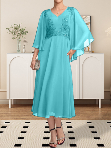 Vestido de corte A, escote en V, largo hasta la rodilla, de gasa, encaje, con lentejuelas y pedrería para la madre de la novia.