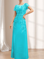 Robe de mère de la mariée en mousseline de dentelle, coupe fourreau/colonne, décolleté illusion, longueur au sol, ornée de sequins
