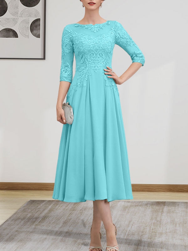 Vestido de novia de corte A, escote redondo ilusión, largo té, de gasa, encaje, con lentejuelas y pedrería.