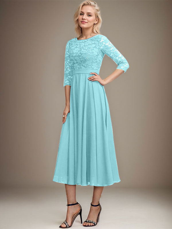 Vestido de novia de corte línea A, escote redondo, largo hasta la rodilla, de encaje y gasa con lentejuelas.