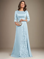 Robe de mère de la mariée en satin de dentelle, coupe trapèze, longue jusqu'au sol, ornée d'appliqués, avec décolleté plongeant et bretelles.