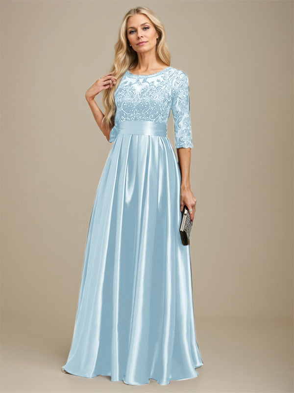 Vestido de madrina de la novia, corte en A, escote ilusión, largo hasta el suelo, satén elástico con encaje y lazo de lentejuelas. 