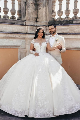 Vestidos de novia de tul con escote corazón, manga larga, apliques y pedrería, estilo princesa, corte princesa, largos hasta el suelo.