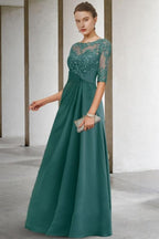 Precioso vestido largo verde de corte A, de encaje y gasa, para la madre de la novia, con mangas.