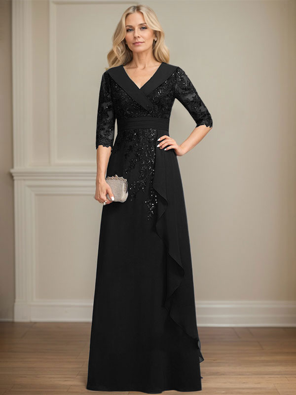 Vestido de novia de corte línea A, cuello en V, largo hasta el suelo, de encaje y gasa, con lentejuelas y volantes en cascada. 