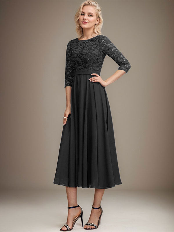 Vestido de novia de corte línea A, escote redondo, largo hasta la rodilla, de encaje y gasa con lentejuelas.