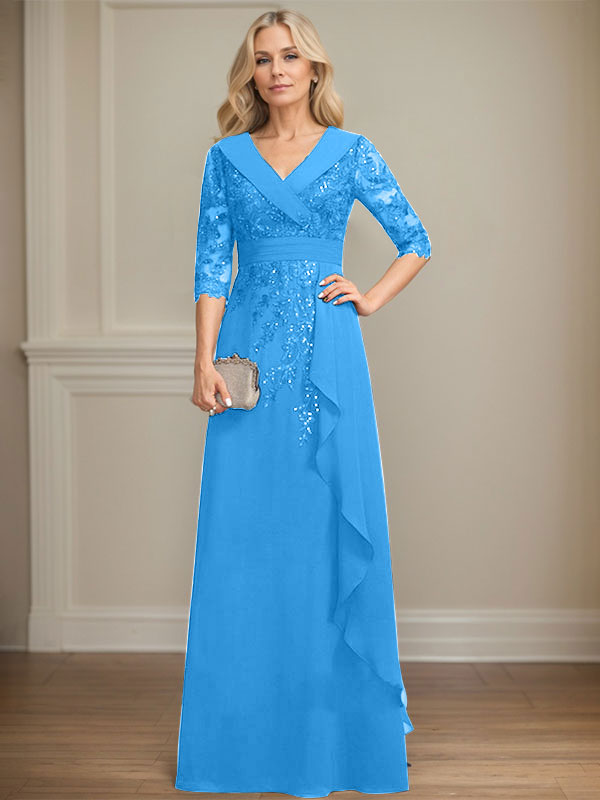 Vestido de novia de corte línea A, cuello en V, largo hasta el suelo, de encaje y gasa, con lentejuelas y volantes en cascada. 