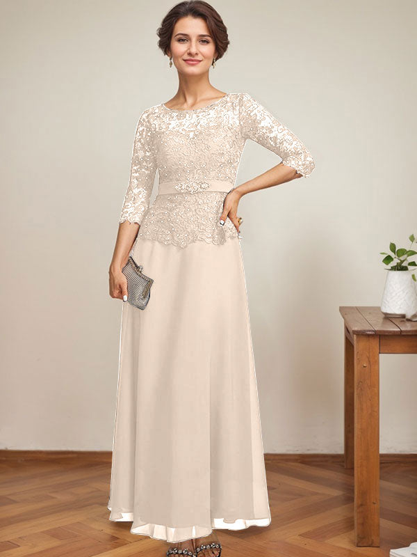 Vestido de novia corte A, escote redondo ilusión, largo hasta el tobillo, de gasa y encaje, con pedrería y detalles de diamantes de imitación. 