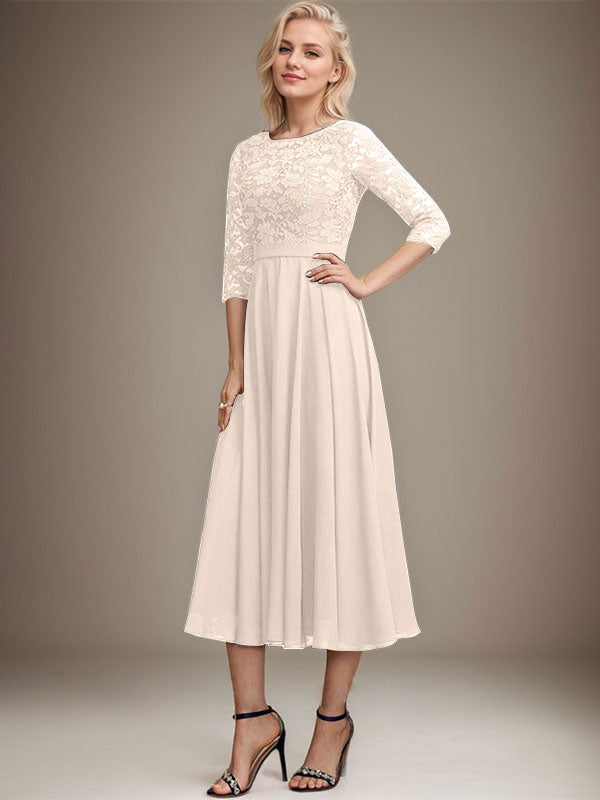 Vestido de novia de corte línea A, escote redondo, largo hasta la rodilla, de encaje y gasa con lentejuelas.