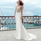 Robes de mariée sirène à manches longues, décolleté rond transparent, boutons en satin appliqués dans le dos, robes de mariée de plage avec traîne balayée 2023 