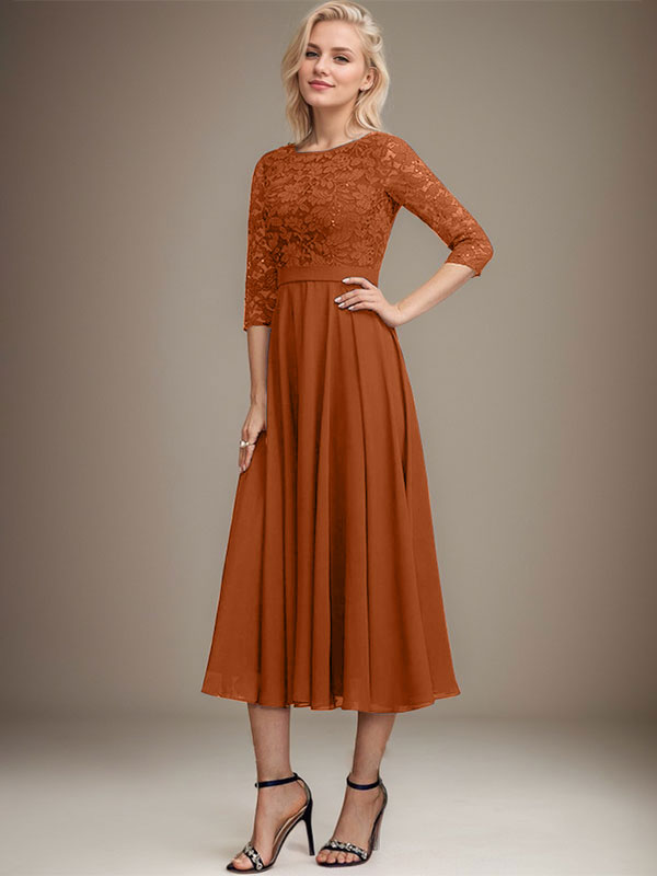 Vestido de novia de corte línea A, escote redondo, largo hasta la rodilla, de encaje y gasa con lentejuelas.