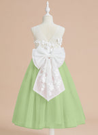 Vestido midi de encaje floral y lazo grande 