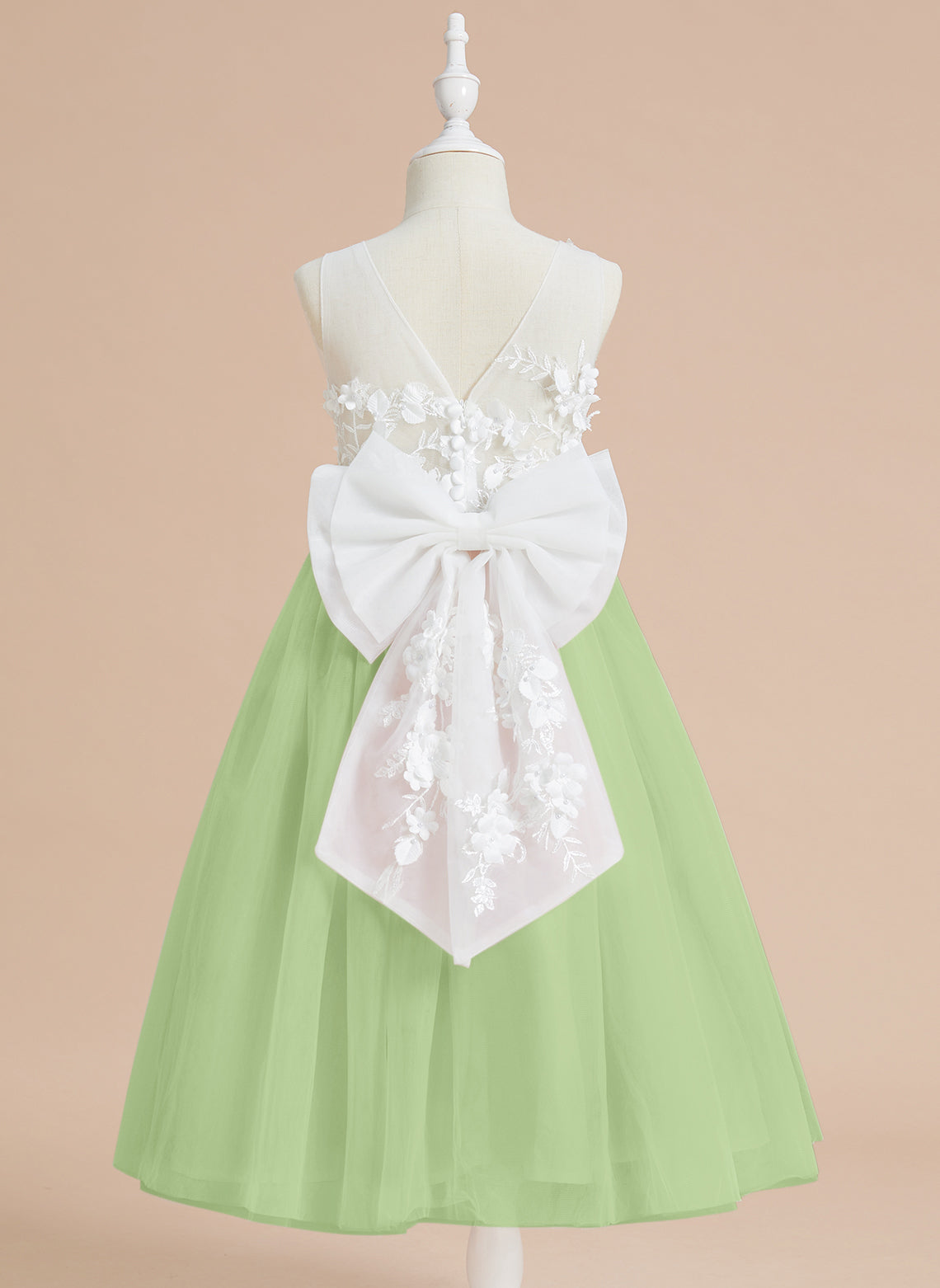 Vestido midi de encaje floral y lazo grande 