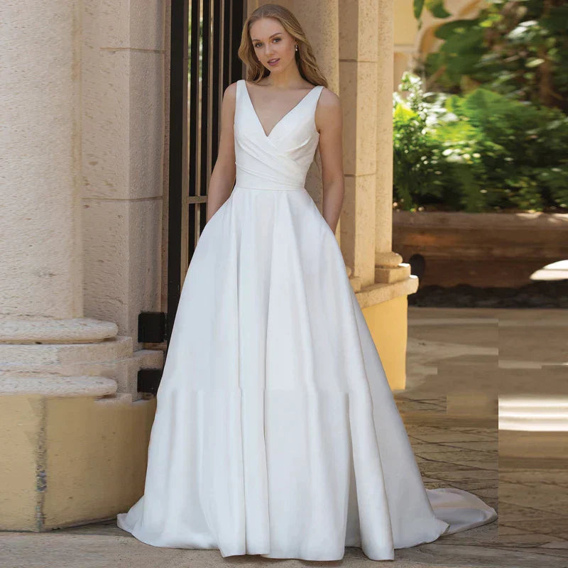 Robes de mariée simples de coupe trapèze avec poches, robe de mariée classique en satin sans manches et dos nu à col en V, nouveautés 