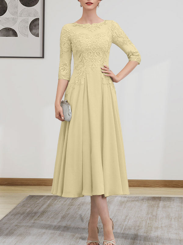 Vestido de novia de corte A, escote redondo ilusión, largo té, de gasa, encaje, con lentejuelas y pedrería.