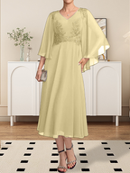 Vestido de corte A, escote en V, largo hasta la rodilla, de gasa, encaje, con lentejuelas y pedrería para la madre de la novia.